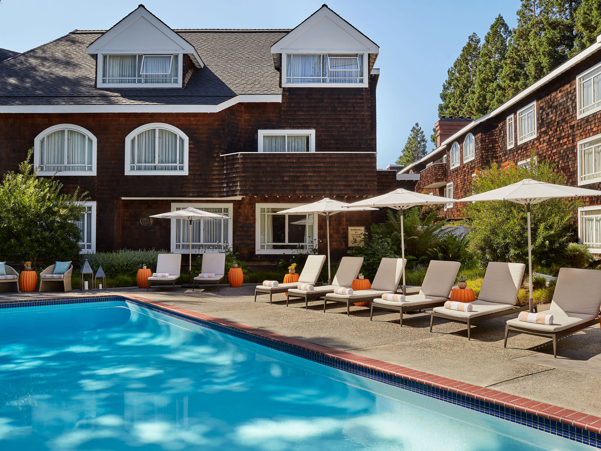 Poolside Lounge Chairs And Umbrellas
