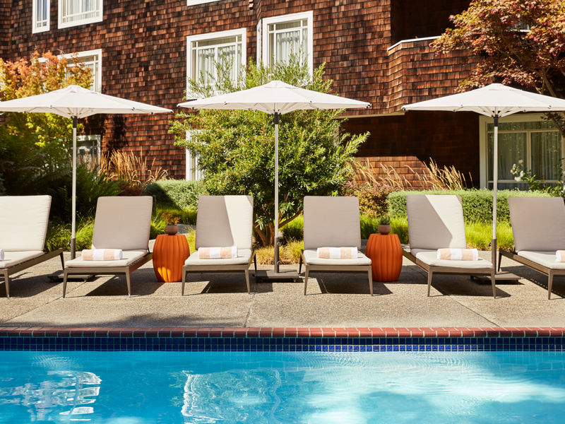 Poolside Lounge Chairs And Umbrellas